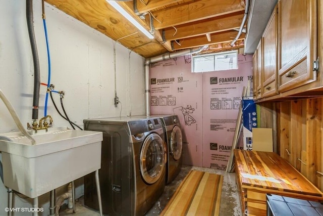 2553 Bristol Ter, Saint Joseph, MI 49085 - laundry area featuring cabinet space and washer and clothes dryer