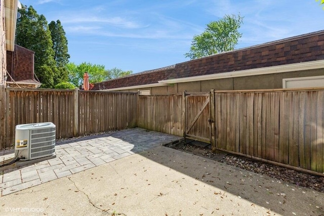 2553 Bristol Ter, Saint Joseph, MI 49085 - view of patio / terrace with central AC unit, a fenced backyard, and a gate