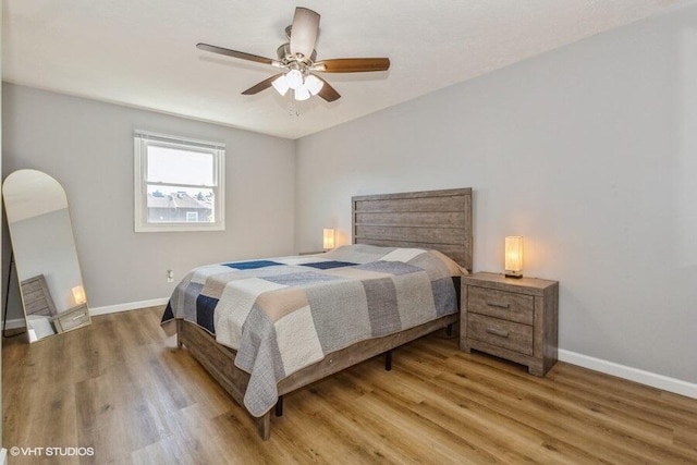 2553 Bristol Ter, Saint Joseph, MI 49085 - bedroom with baseboards, light wood-style flooring, and a ceiling fan
