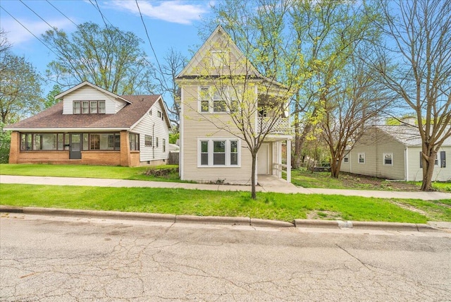 470 Houseman Ave NE, Grand Rapids, MI 49503 - view of front facade with a front yard, an attached garage, and driveway
