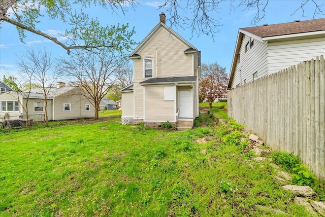 470 Houseman Ave NE, Grand Rapids, MI 49503 - back of property featuring a chimney