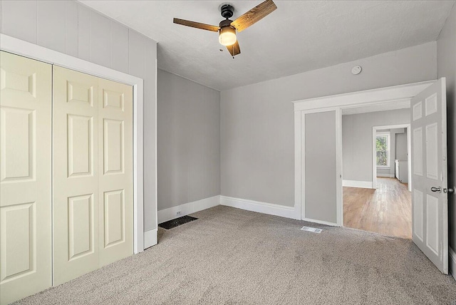 470 Houseman Ave NE, Grand Rapids, MI 49503 - unfurnished bedroom with carpet flooring, baseboards, a closet, and ceiling fan