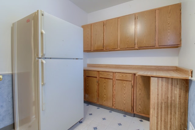 33951 Old Timber Rd, Farmington Hills, MI 48331 - kitchen featuring freestanding refrigerator, light countertops, light floors, and brown cabinetry