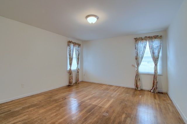 33951 Old Timber Rd, Farmington Hills, MI 48331 - unfurnished room with healthy amount of natural light, wood finished floors, and baseboards