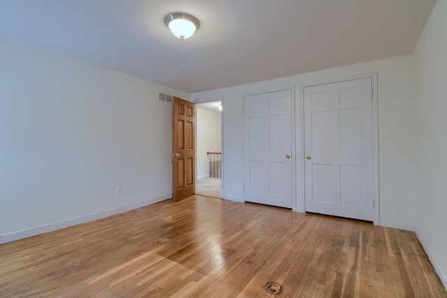 33951 Old Timber Rd, Farmington Hills, MI 48331 - unfurnished bedroom with light wood finished floors and baseboards
