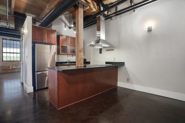 6533 E Jefferson Ave Unit 413W, Detroit, MI 48207 - kitchen featuring freestanding refrigerator, wall chimney range hood, dark countertops, baseboards, and electric stovetop