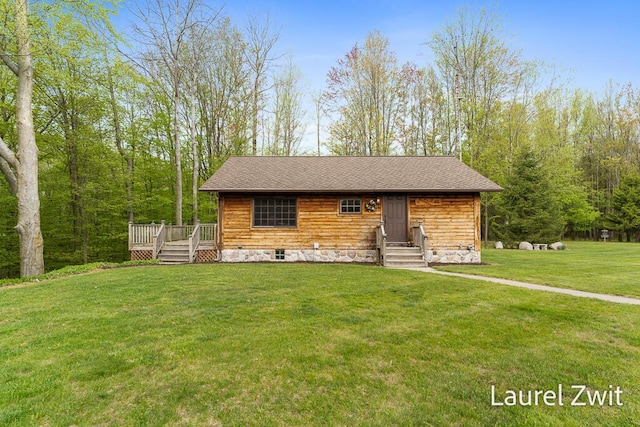 1442 W Tyler Rd, Hart, MI 49420 - view of front of property featuring a front lawn, a deck, and roof with shingles