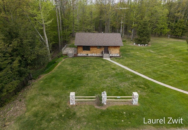 1442 W Tyler Rd, Hart, MI 49420 - view of front of house featuring a forest view and a deck