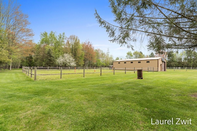 1442 W Tyler Rd, Hart, MI 49420 - view of yard featuring a pole building, an outbuilding, and a view of rural / pastoral area