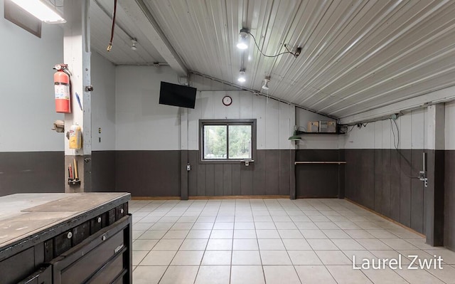1442 W Tyler Rd, Hart, MI 49420 - kitchen featuring lofted ceiling, wainscoting, and wooden walls