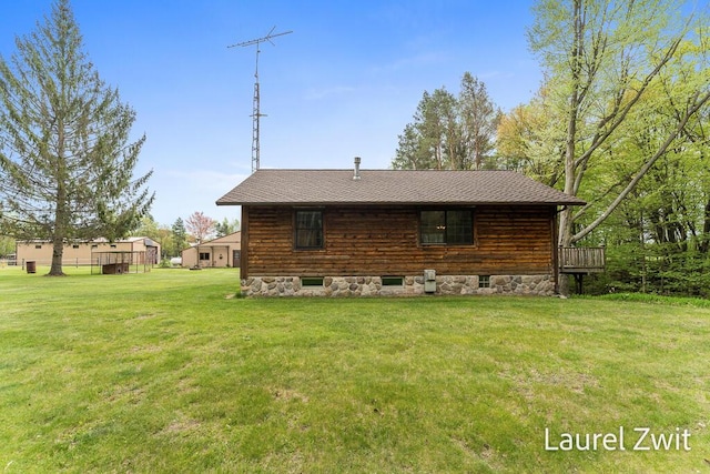 1442 W Tyler Rd, Hart, MI 49420 - rear view of property featuring a lawn