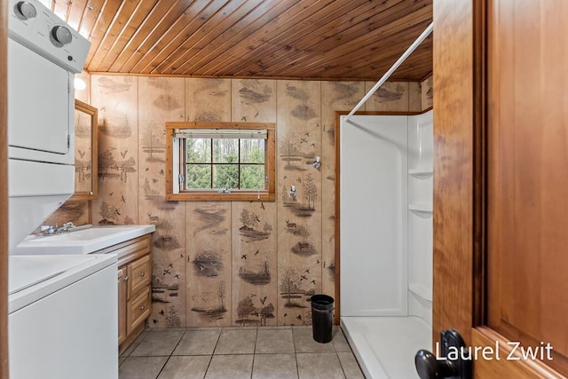 1442 W Tyler Rd, Hart, MI 49420 - full bathroom with stacked washer / dryer, wood ceiling, a stall shower, tile patterned floors, and vanity