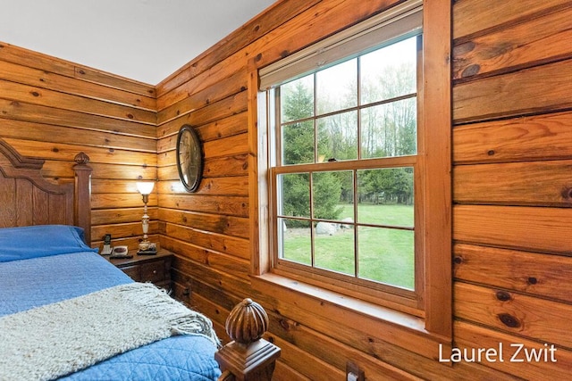 1442 W Tyler Rd, Hart, MI 49420 - bedroom with multiple windows and wooden walls