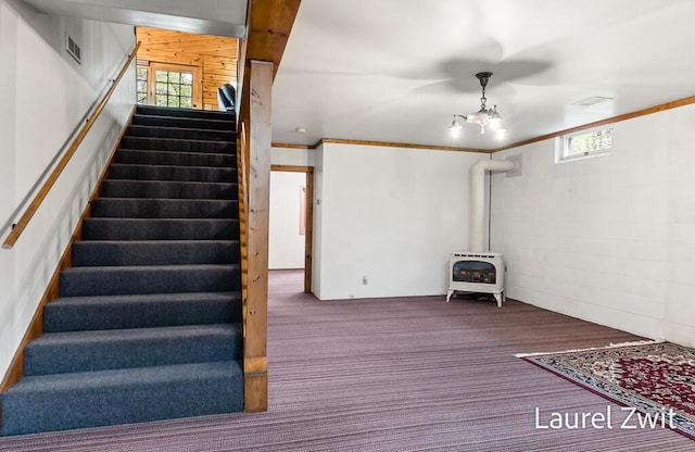 1442 W Tyler Rd, Hart, MI 49420 - basement with a wood stove, stairway, and carpet