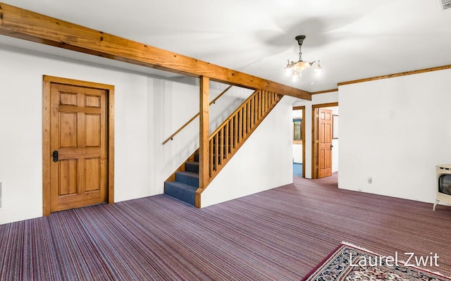 1442 W Tyler Rd, Hart, MI 49420 - below grade area featuring stairs, carpet floors, and a chandelier