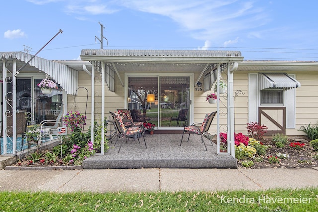 back of property featuring covered porch