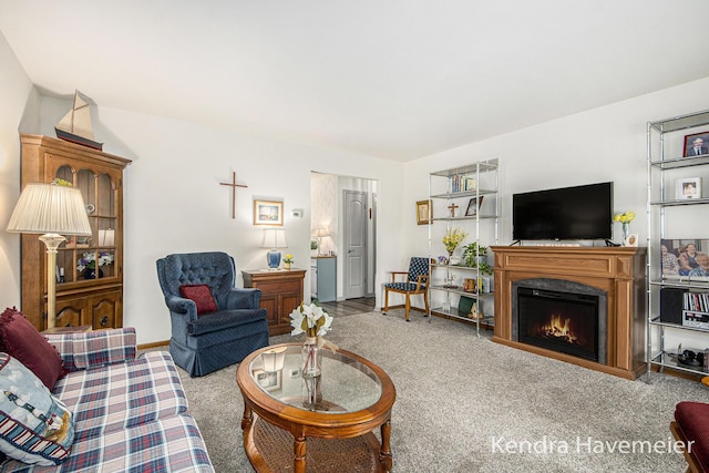 living room featuring carpet and a lit fireplace