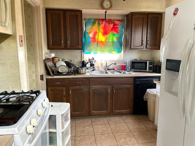 19400 Greydale Ave, Detroit, MI 48219 - kitchen featuring white appliances, a sink, light countertops, light tile patterned flooring, and backsplash