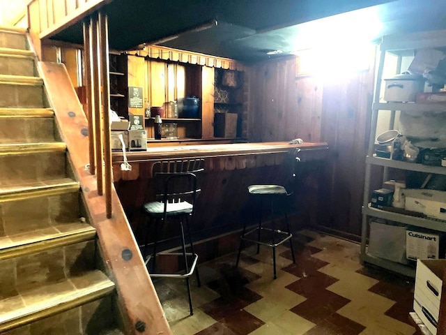 19400 Greydale Ave, Detroit, MI 48219 - indoor dry bar with tile patterned floors and wood walls