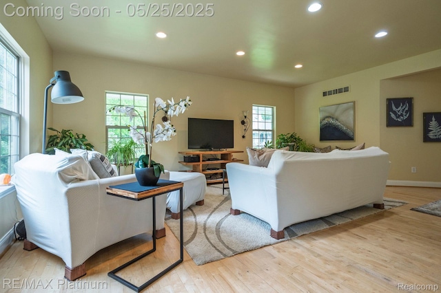 2038 Pine Bluffs Ct, Highland, MI 48357 - living room with wood finished floors, recessed lighting, and baseboards