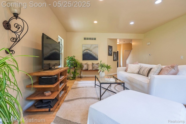 2038 Pine Bluffs Ct, Highland, MI 48357 - living area with light wood-style floors, recessed lighting, and stairs