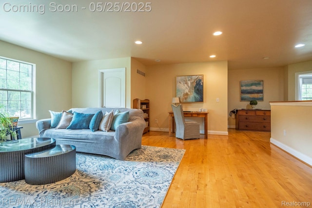 2038 Pine Bluffs Ct, Highland, MI 48357 - living room featuring recessed lighting, wood finished floors, and baseboards