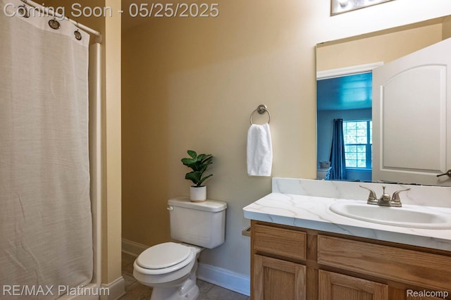 2038 Pine Bluffs Ct, Highland, MI 48357 - bathroom featuring vanity, toilet, baseboards, and a shower with shower curtain