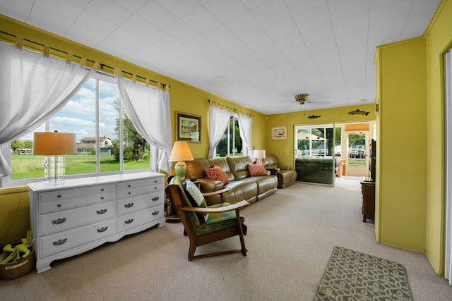 living room with light carpet and a ceiling fan