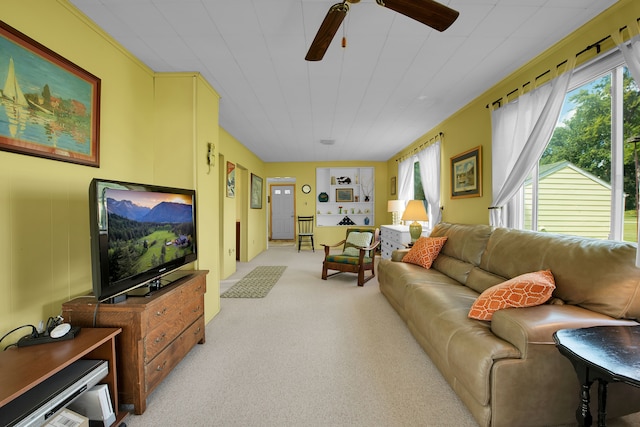 living room with ceiling fan and light colored carpet