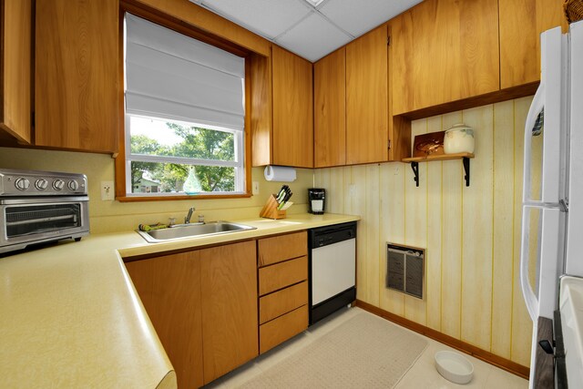 kitchen with white appliances, a sink, light countertops, open shelves, and brown cabinets