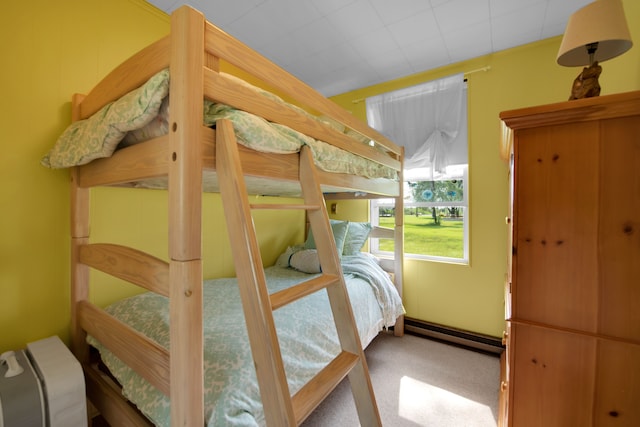 carpeted bedroom with baseboard heating