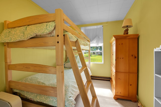 carpeted bedroom with baseboard heating
