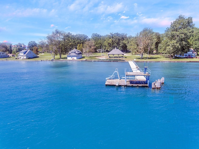 dock area with a gazebo and a water view