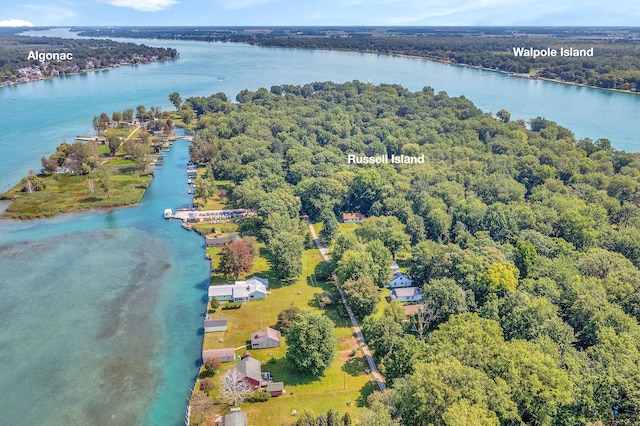 aerial view of a nearby body of water and a heavily wooded area