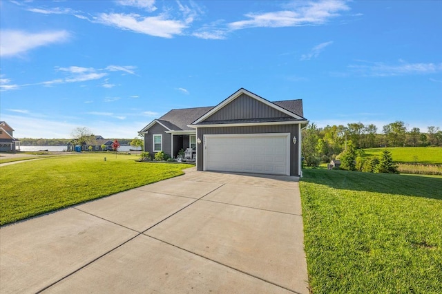 3582 Pratt Dr, Lapeer, MI 48446 - view of front of home with a front lawn, driveway, a garage, and board and batten siding