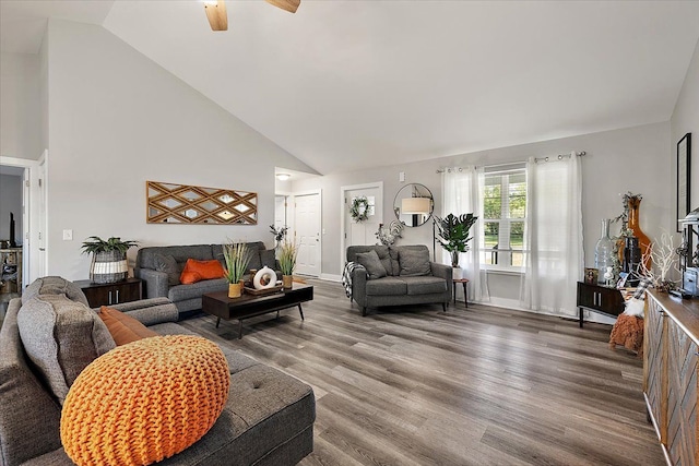3582 Pratt Dr, Lapeer, MI 48446 - living area with high vaulted ceiling, wood finished floors, a ceiling fan, and baseboards