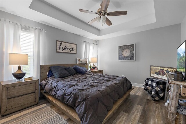 3582 Pratt Dr, Lapeer, MI 48446 - bedroom featuring a raised ceiling, wood finished floors, baseboards, and ceiling fan