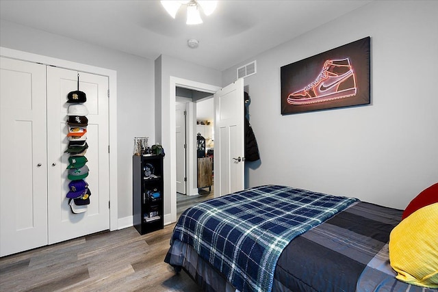 3582 Pratt Dr, Lapeer, MI 48446 - bedroom with wood finished floors, a ceiling fan, baseboards, and a closet