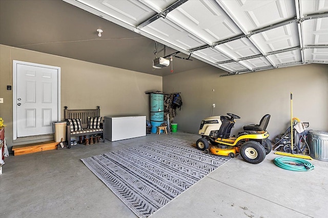 3582 Pratt Dr, Lapeer, MI 48446 - garage with a garage door opener and refrigerator