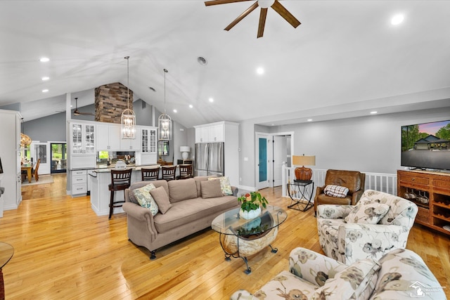 2307 Tecumseh Dr, Brooklyn, MI 49230 - living room with ceiling fan, light wood-style flooring, a chandelier, recessed lighting, and high vaulted ceiling