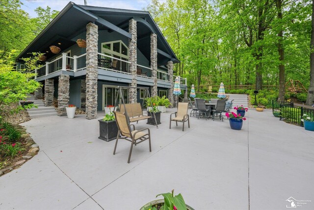 2307 Tecumseh Dr, Brooklyn, MI 49230 - view of patio featuring a balcony and fence