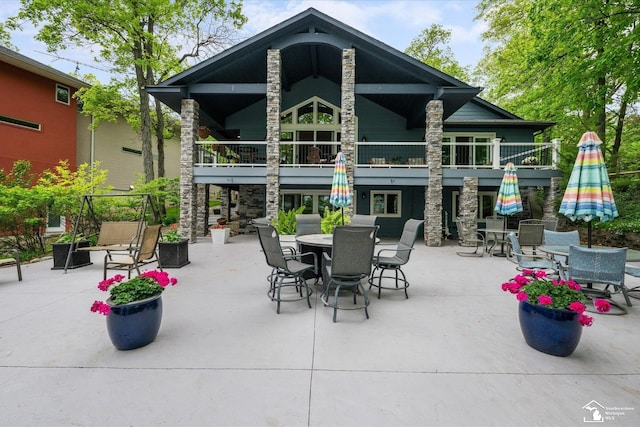 2307 Tecumseh Dr, Brooklyn, MI 49230 - back of house featuring outdoor dining area, a patio, and a balcony