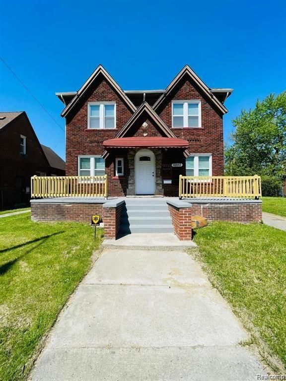 16917 Monica St, Detroit, MI 48221 - view of front of property with covered porch, a front yard, and brick siding