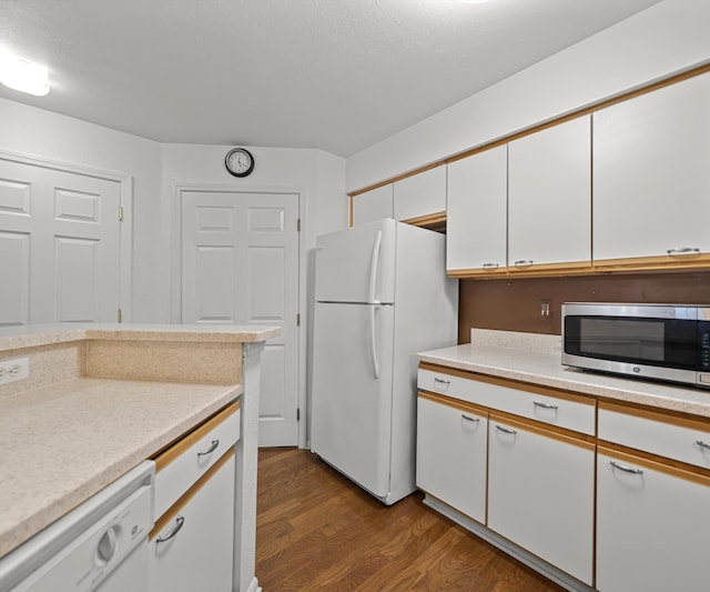 1379 Millbrook Trl, Ann Arbor, MI 48108 - kitchen with white appliances, dark wood finished floors, white cabinetry, and light countertops