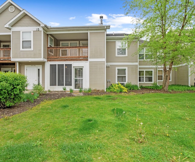 1379 Millbrook Trl, Ann Arbor, MI 48108 - rear view of property with a lawn and a balcony