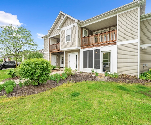 1379 Millbrook Trl, Ann Arbor, MI 48108 - back of property with a balcony and a lawn