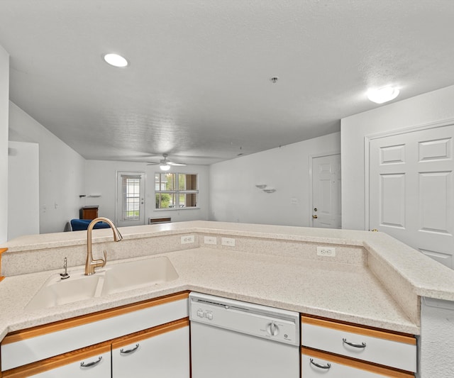 1379 Millbrook Trl, Ann Arbor, MI 48108 - kitchen featuring white dishwasher, a sink, a ceiling fan, open floor plan, and white cabinetry