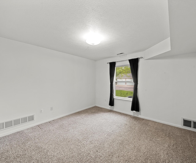 1379 Millbrook Trl, Ann Arbor, MI 48108 - unfurnished room featuring carpet floors, a textured ceiling, and baseboards