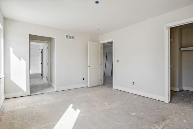 45070 Twin River Dr, Macomb, MI 48044 - unfurnished bedroom with baseboards and ensuite bath
