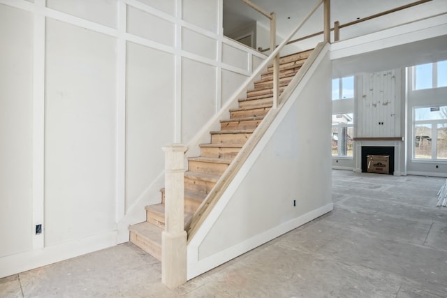 45070 Twin River Dr, Macomb, MI 48044 - stairs featuring a fireplace and baseboards